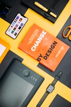 Change by Design by Tim Brown book beside smartphone