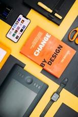 Change by Design by Tim Brown book beside smartphone