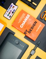 Change by Design by Tim Brown book beside smartphone