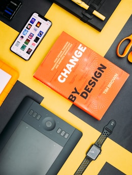 Change by Design by Tim Brown book beside smartphone