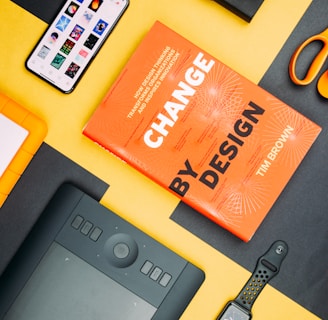 Change by Design by Tim Brown book beside smartphone