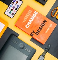 Change by Design by Tim Brown book beside smartphone