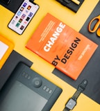 Change by Design by Tim Brown book beside smartphone