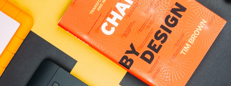 Change by Design by Tim Brown book beside smartphone