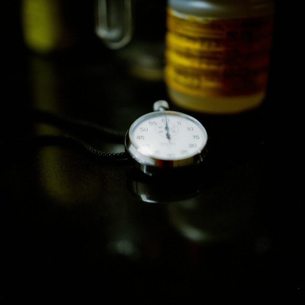 selective focus photography of pocket watch