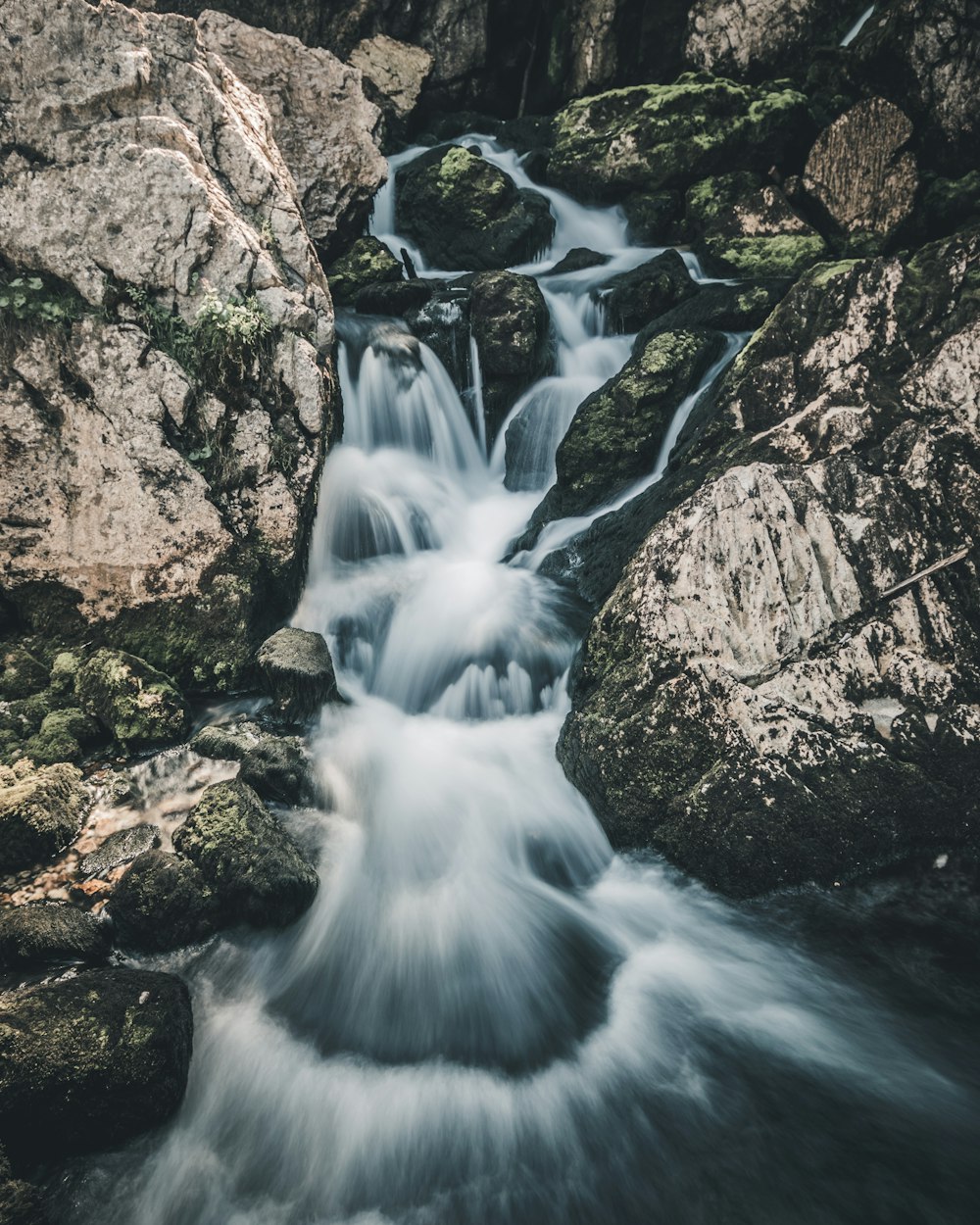 timelaps photography of river with rock formation