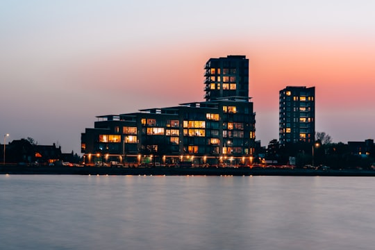 black building beside body of water in Amager Strandpark Denmark