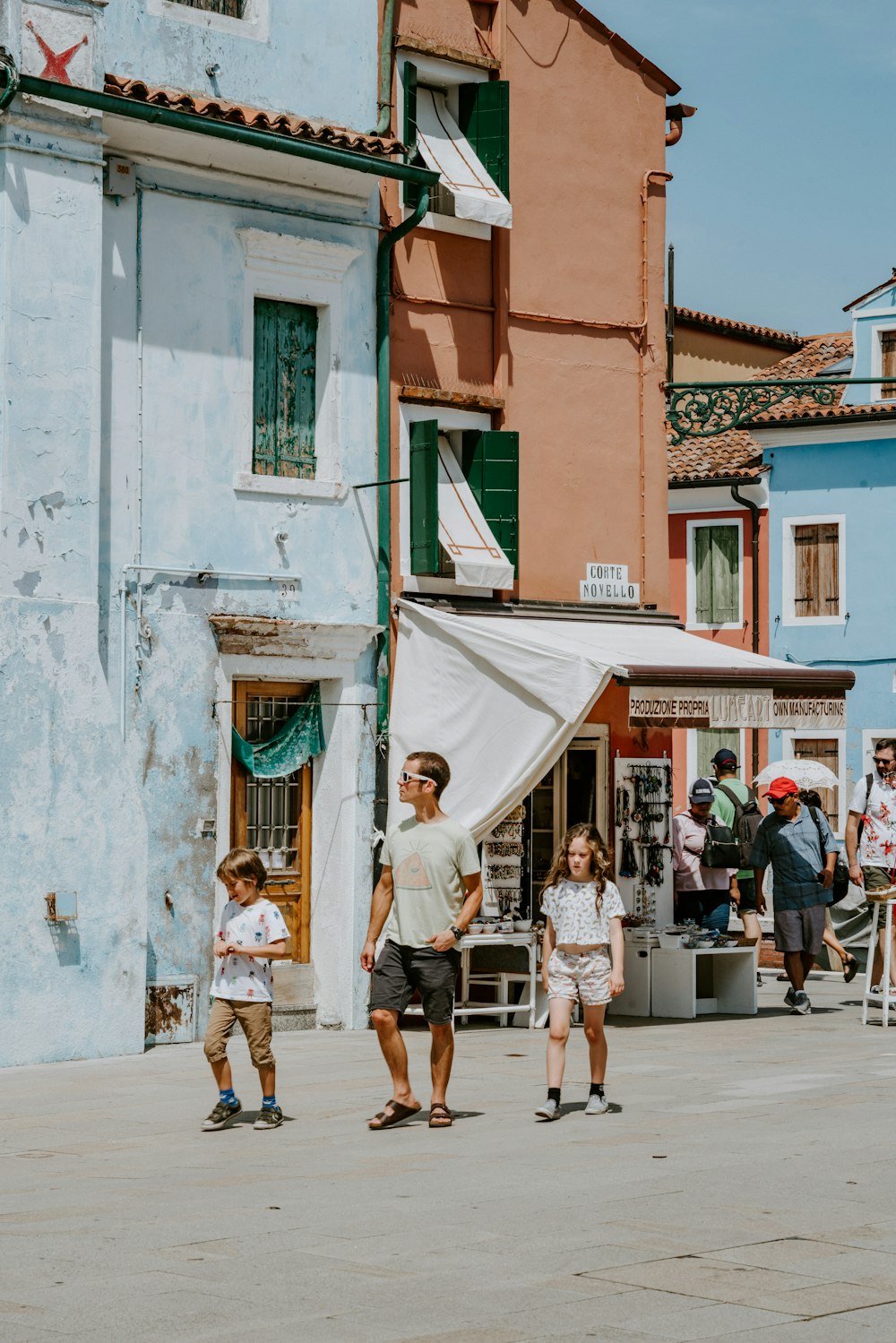 photo of man and woman walking near house