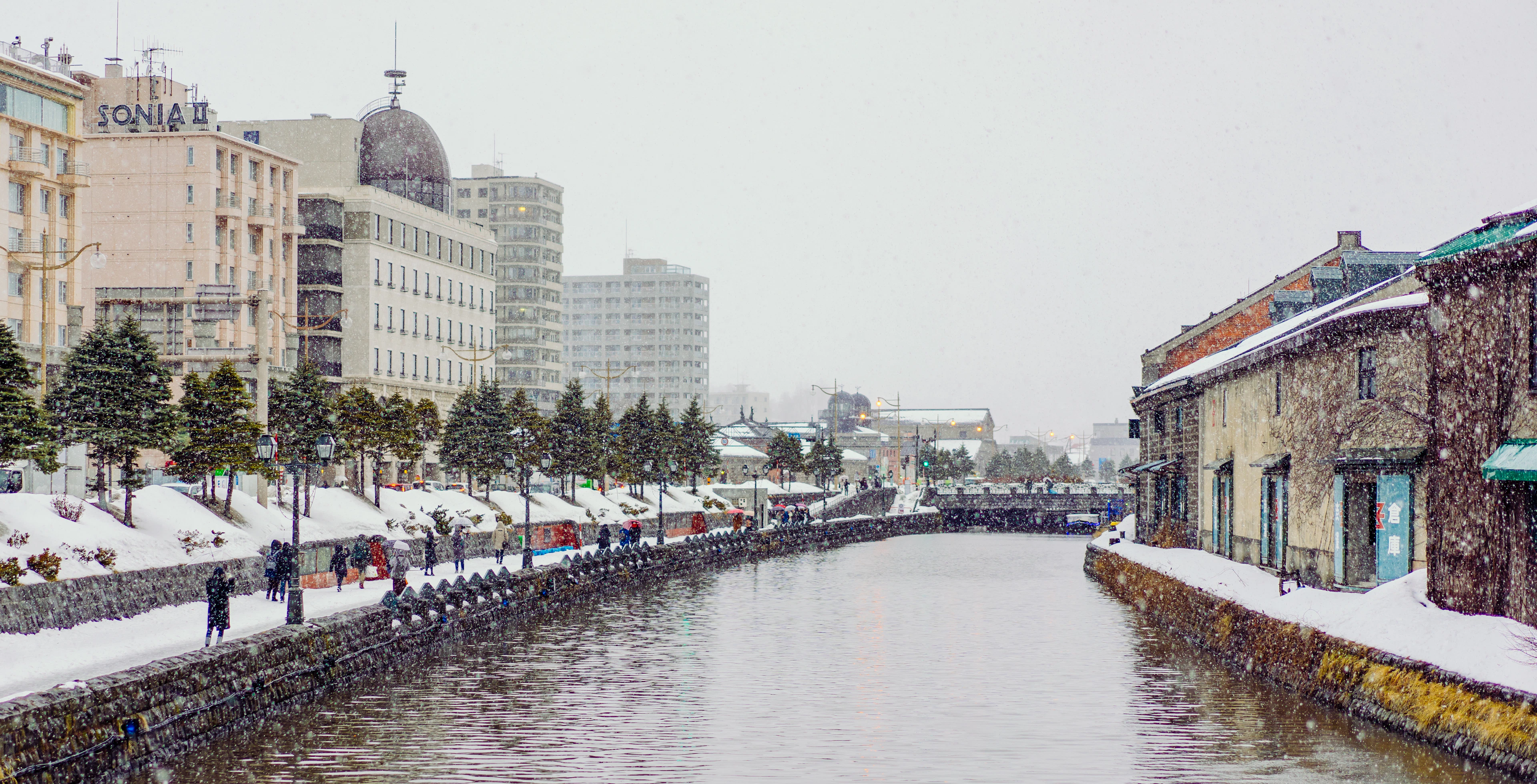 The snow-covered Otaru canal and its old stone warehouses