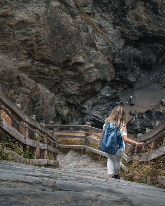 woman walking on bridge in Tintagel United Kingdom