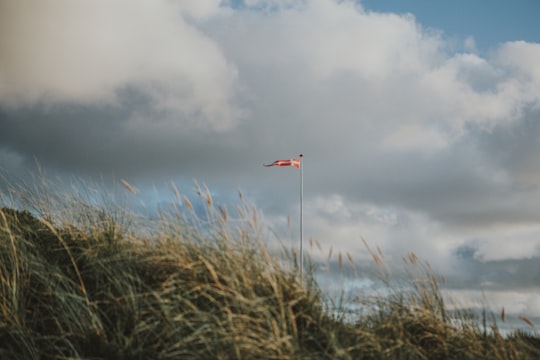 orange and white flag in Løkken Denmark