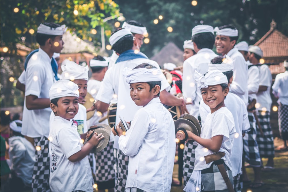 boys participating parade holding handheld cymbals