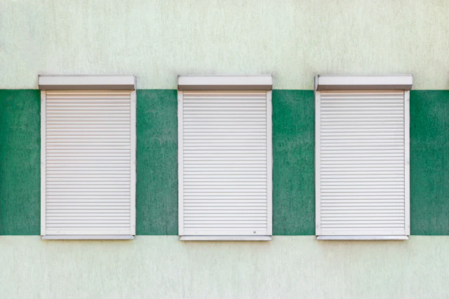 Closed roller shutters on a building facade