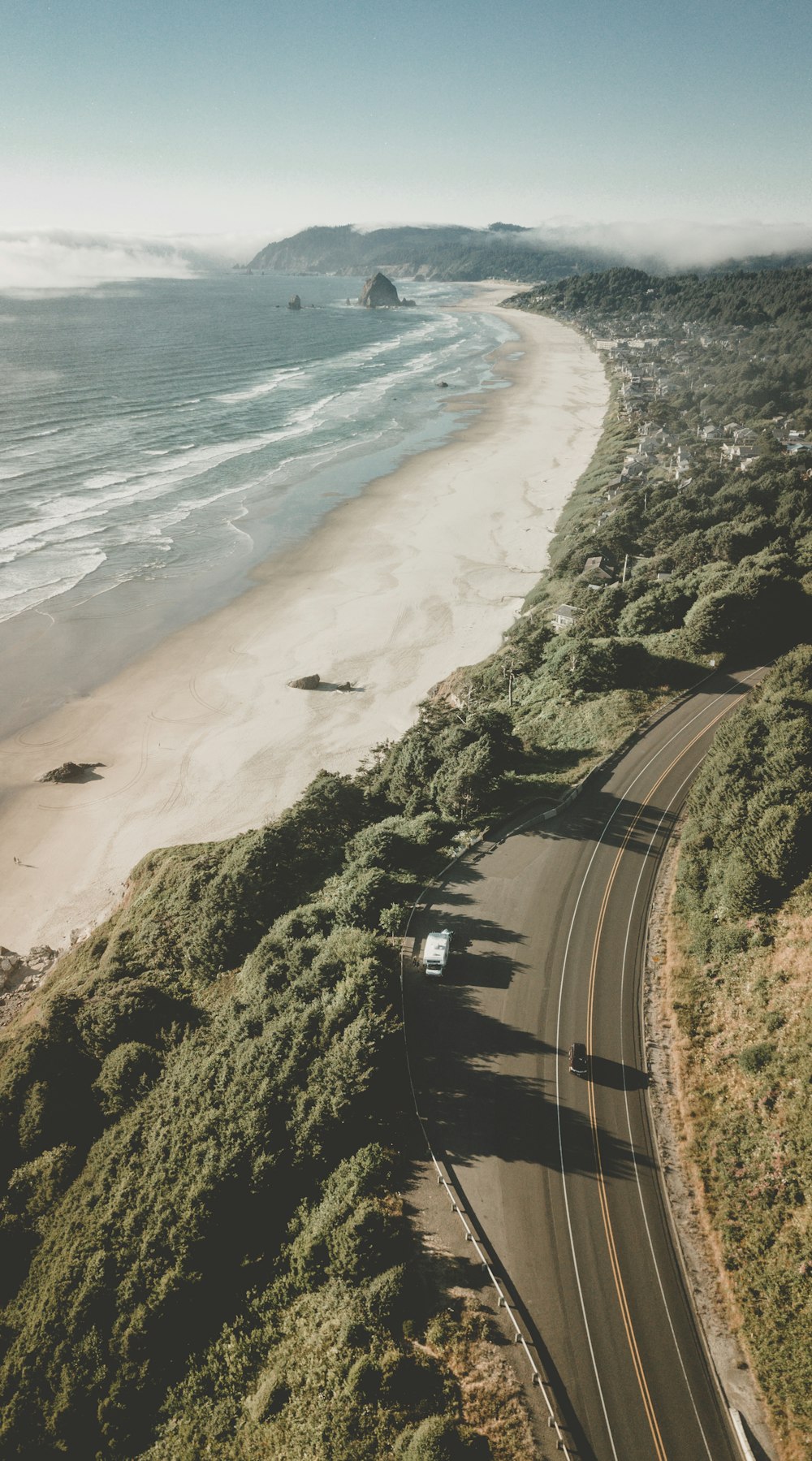 aerial photography of road near sea