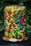 A vibrant assortment of colorful gummy candies displayed in a clear jar.