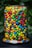 A vibrant assortment of colorful gummy candies displayed in a clear jar.