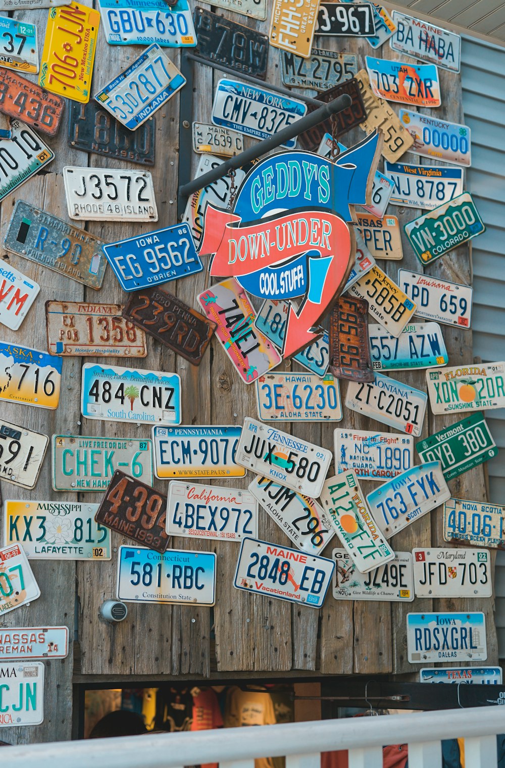 license plate mounted in brown board