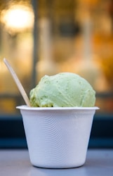 selective focus photo of cup of ice cream