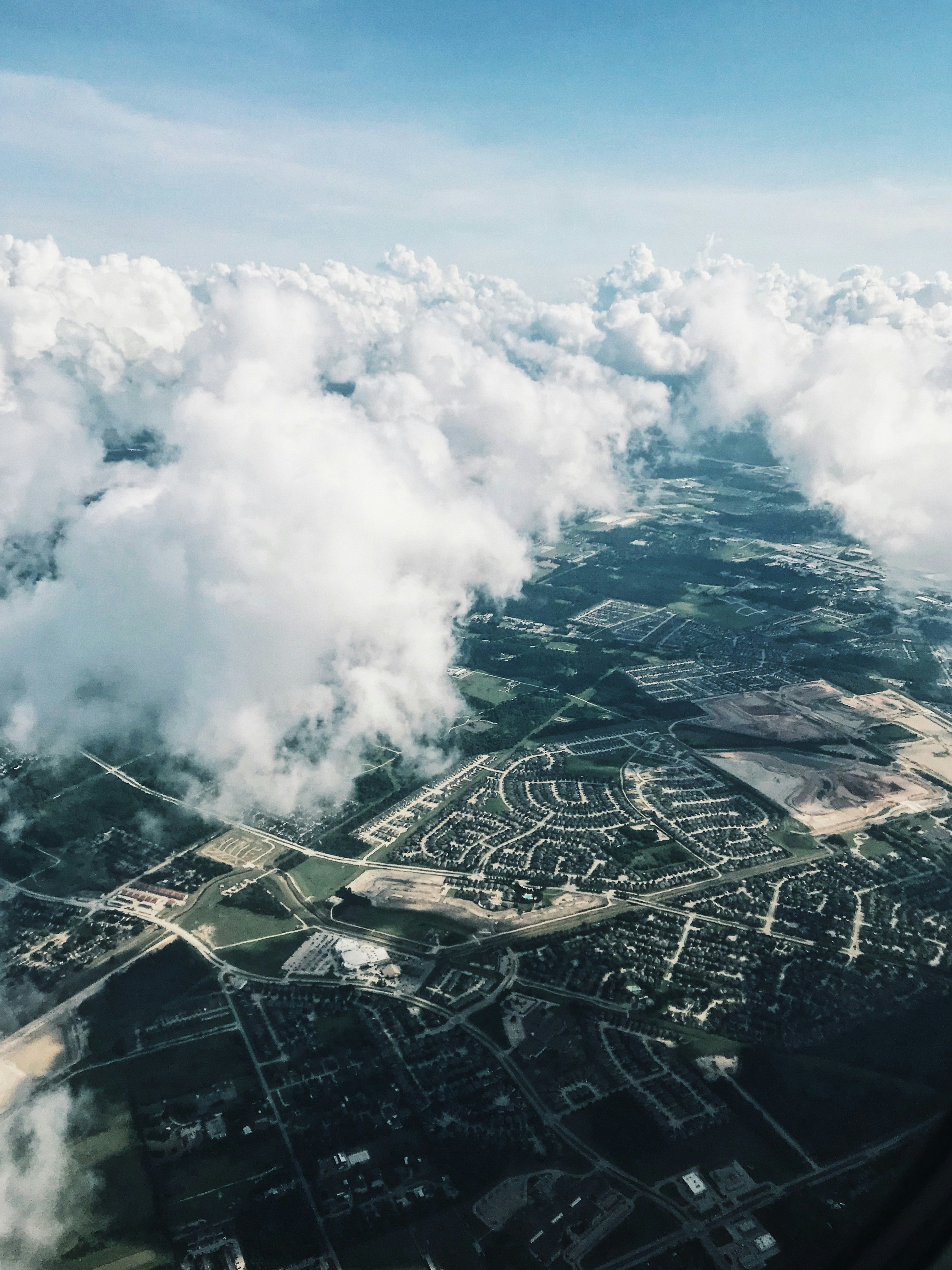 aerial photography of houses, roads, and buildings