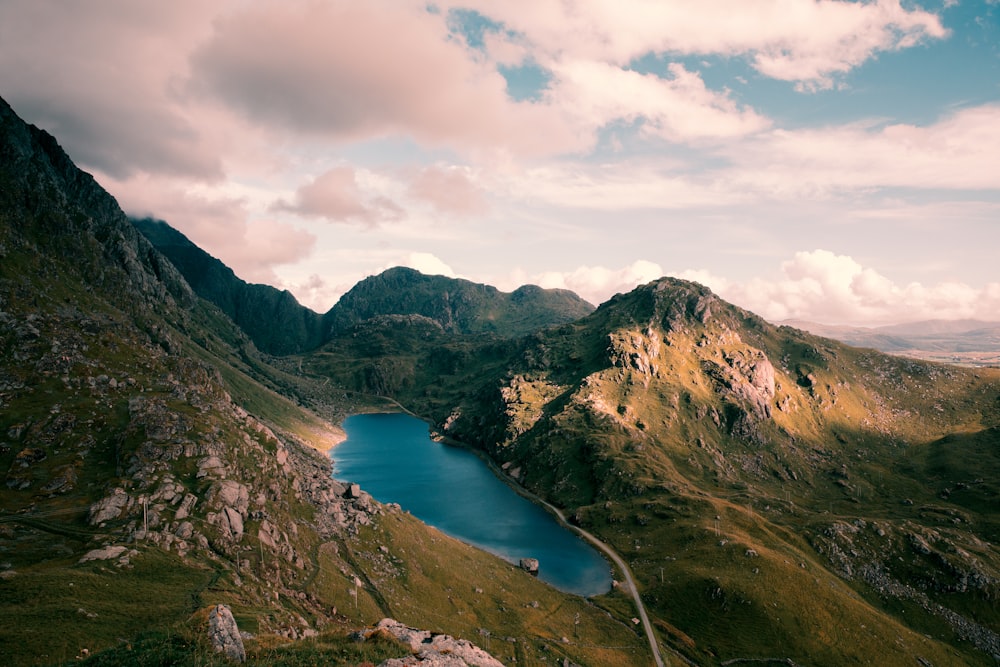 aerial photography of lake and mountain at daytime