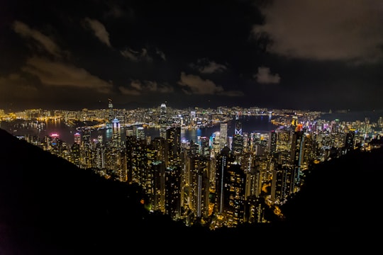 aerial view of city during nighttime in Victoria Harbour Hong Kong
