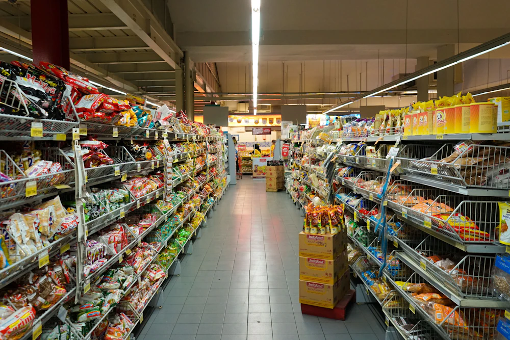 Market shelves filled with pantry goods and produce