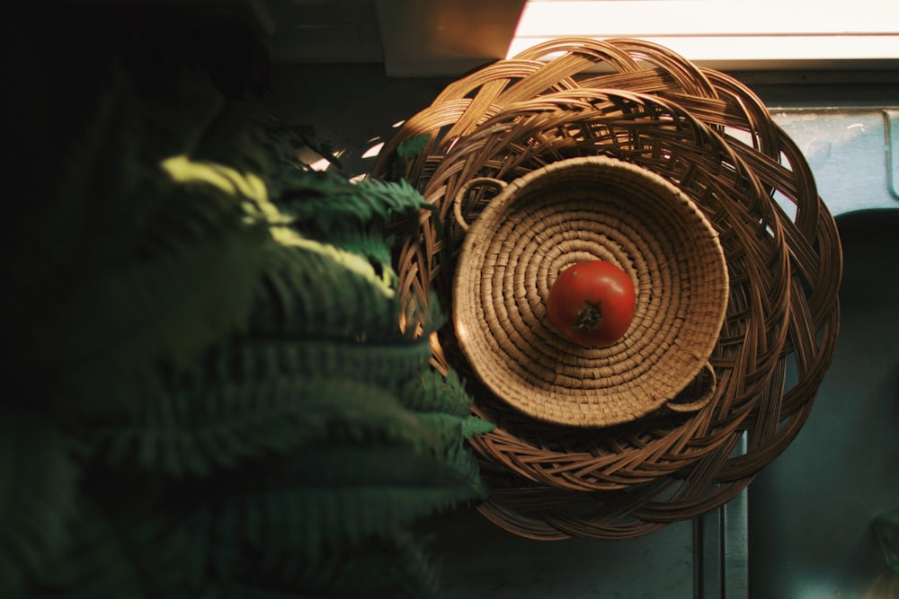 red tomato in basket