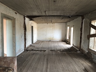Empty room with old furniture being removed to improve property appeal.
