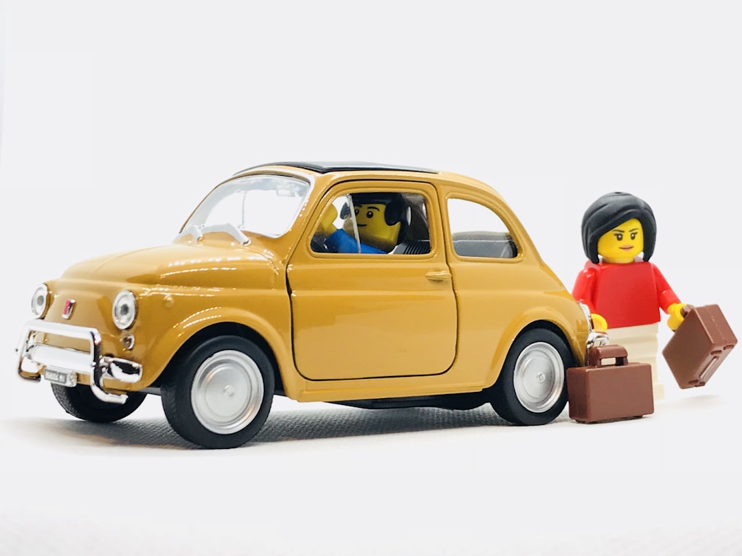 yellow Volkswagen Beetle scale model and two minifigs, As a certified LEGO (R) Serious PLay Facilitator (R), I recently bought some bricks to start preparing for a workshop in Poland. I usually store all of my toys and brick sets in one place so i tried to experiment with the LEGO(R) set and my diecast models.</p></figure><p>What i tried portraying is my love for travel, especially road trips together with my girfriend. I am planning to go on a road trip in Italy, discovering all the beautiful areas otherwise hidden from the main and regular tourists. What could better portray this than two puppets loading all the bags in a very Italian yellow Fiat 500.