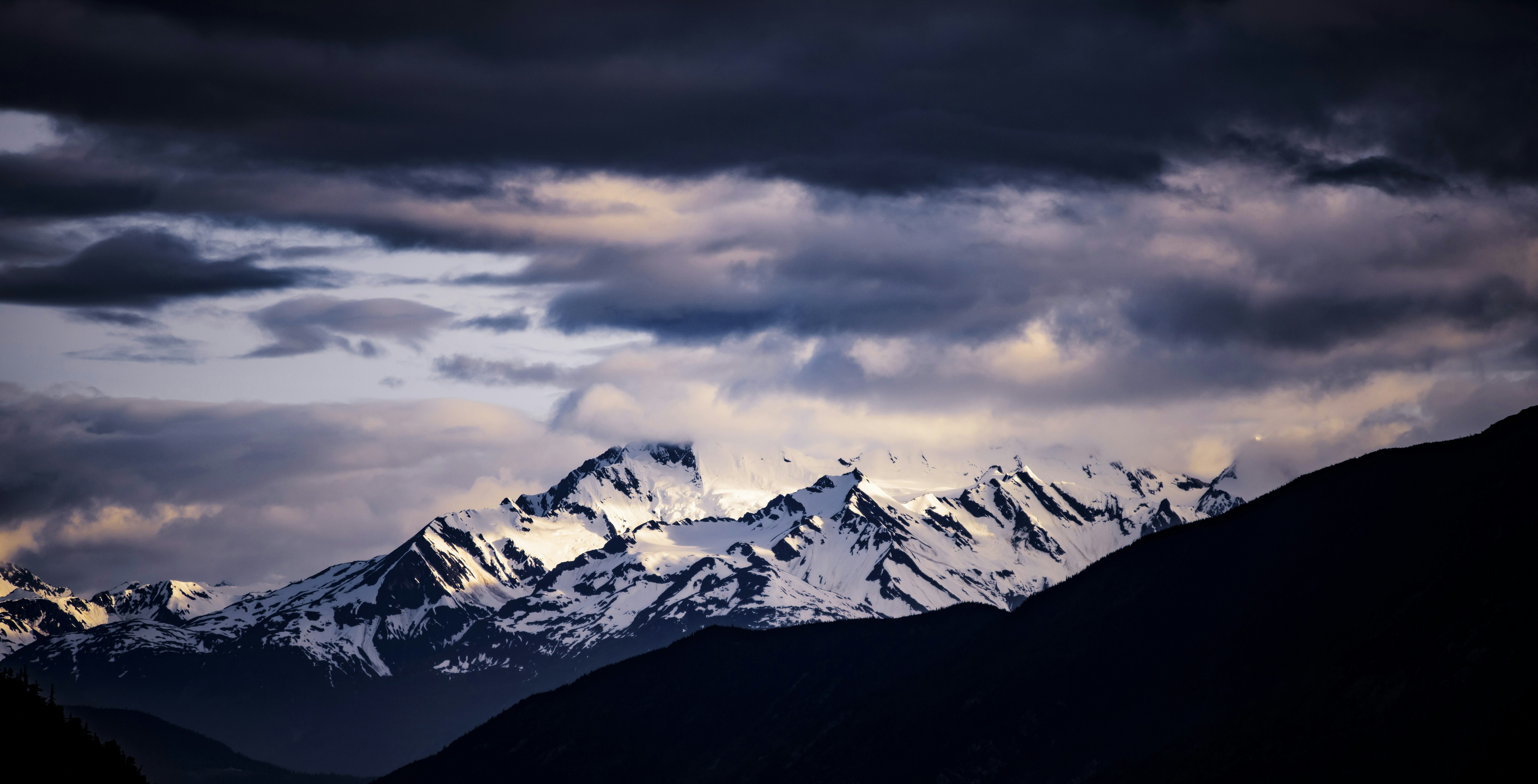 snowy mountain, Snowy Alaskan Mountain range in the Storm