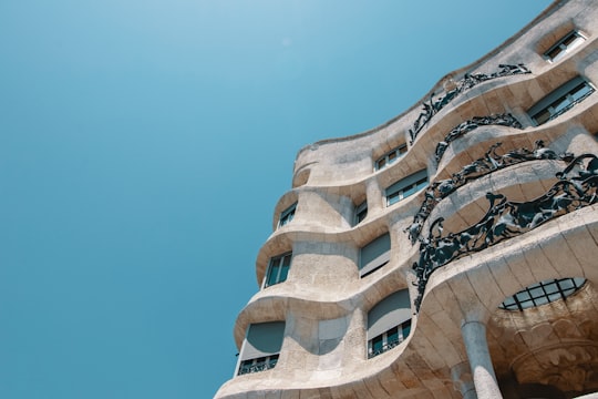 low-angle photography of beige concrete building in Casa Mila Spain