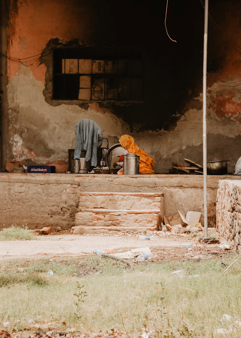 A woman cooking on a wood-burning cookstove