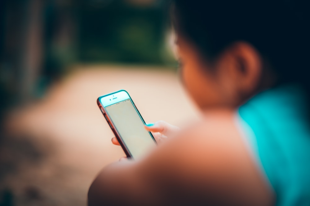 woman looking at her phone