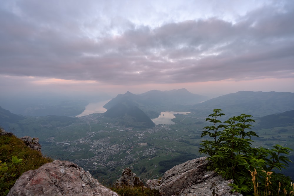 a view of a mountain range with a body of water in the distance