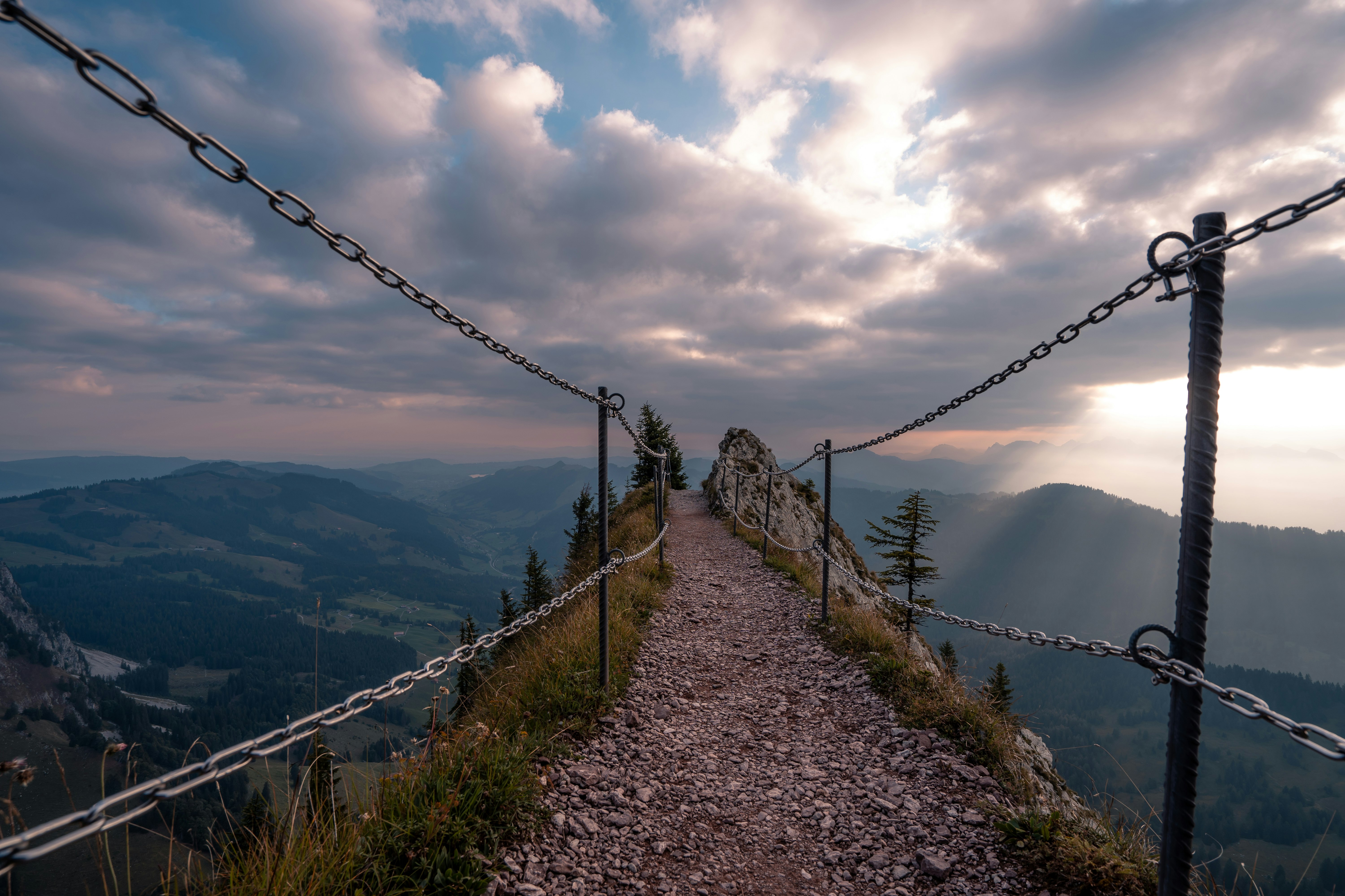 road with cliff at daytime