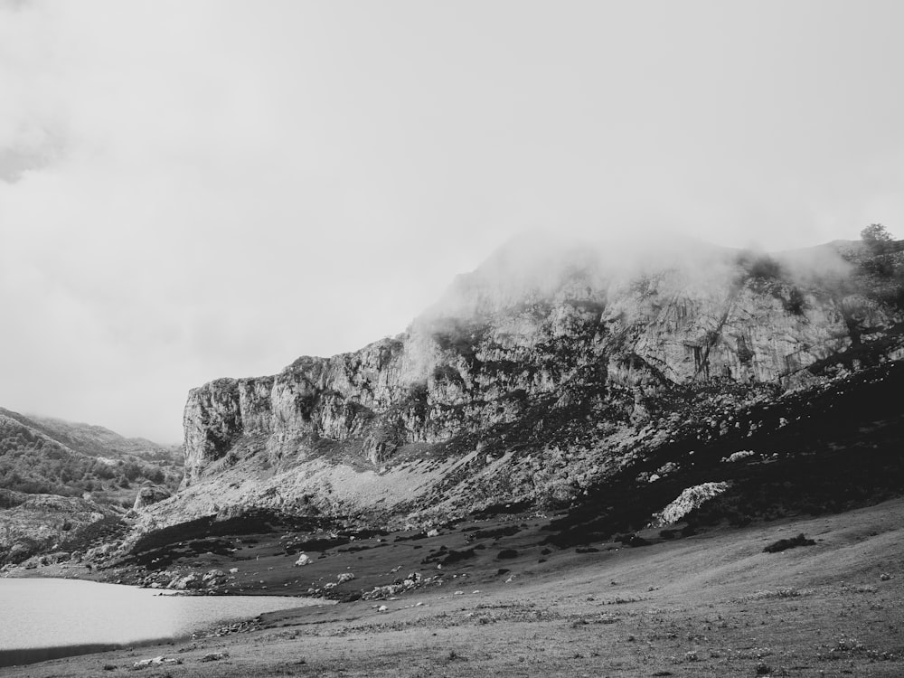 snow-capped mountain under cloudy sky