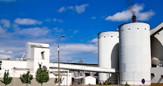 Exterior view of Galawhip's steel cylinder manufacturing factory in Algeria under a clear blue sky.
