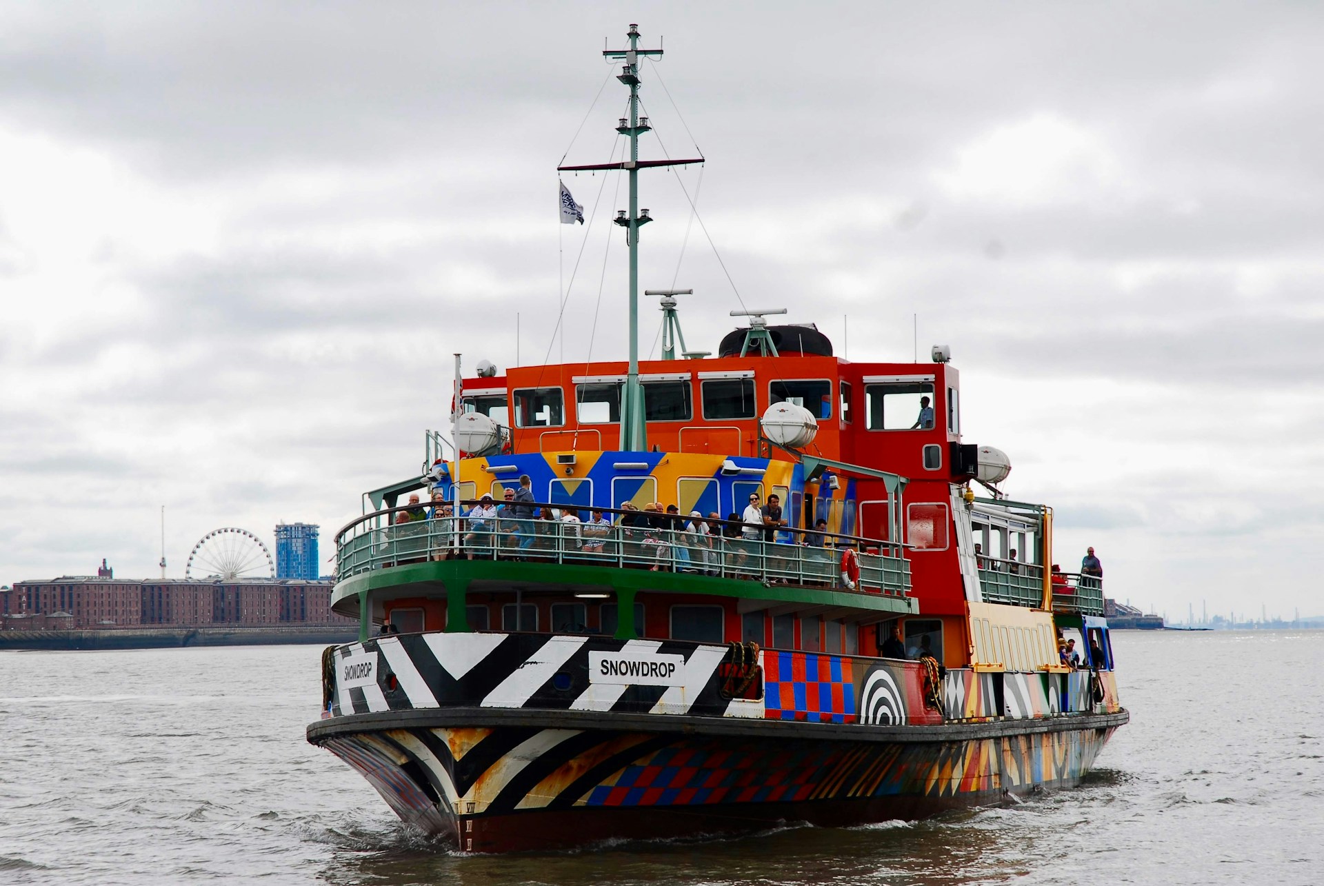 woman wearing yellow long-sleeved dress under white clouds and blue sky during daytime
