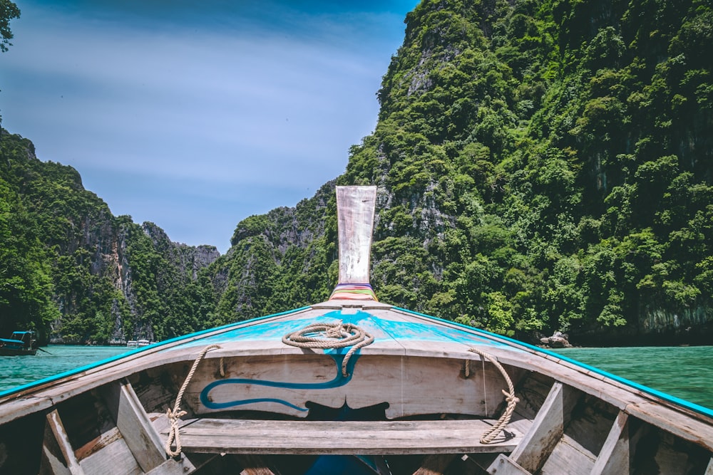 brown and brown wooden canoe boat