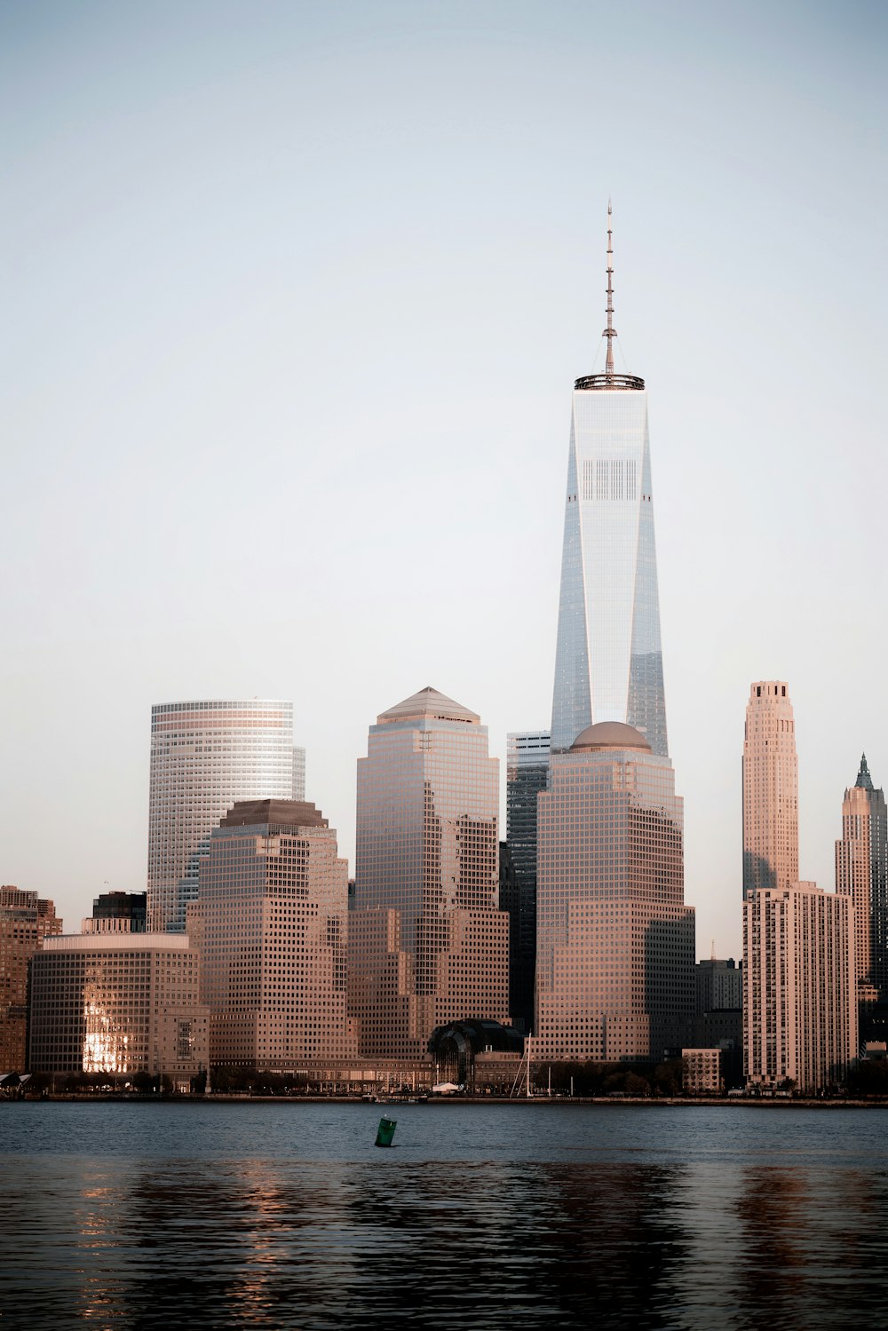 body of water near high-rise buildings illustration