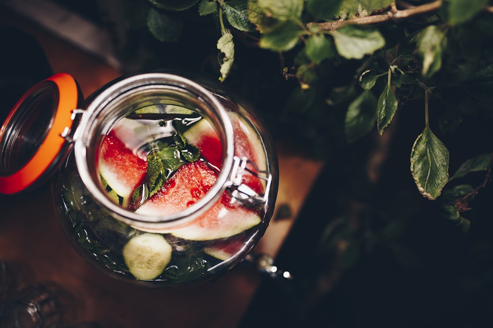 selective focus photography of mason jar filled with liquid