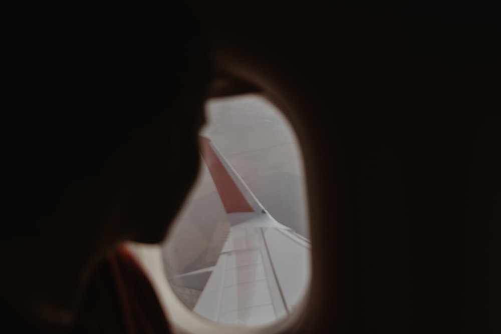 a view of the wing of an airplane through a window