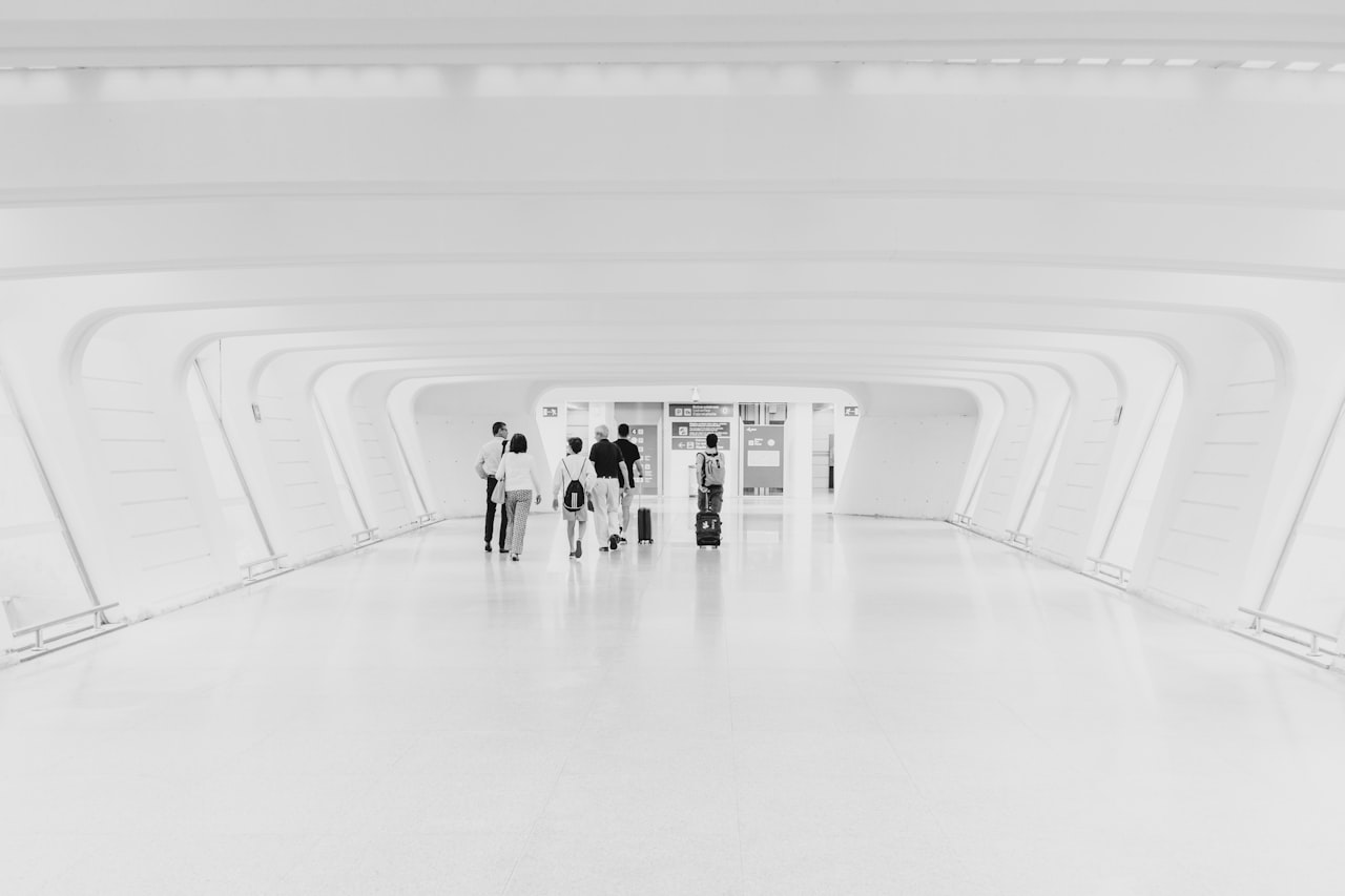 people on hallway of Bilbao Airport