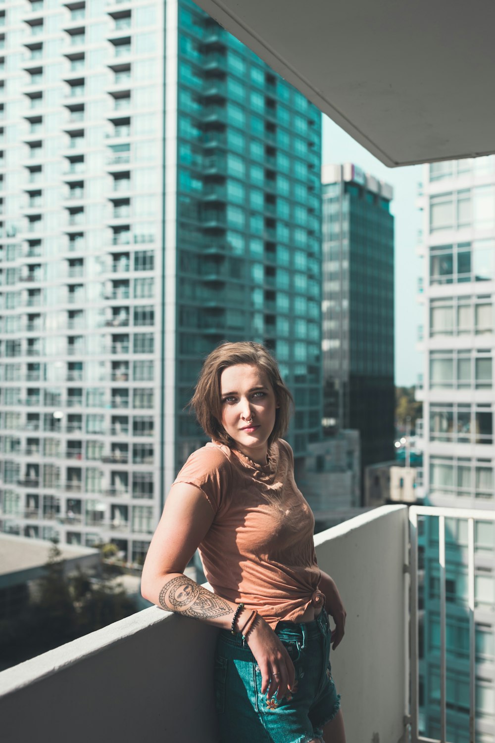 woman wearing brown dress standing inside the building