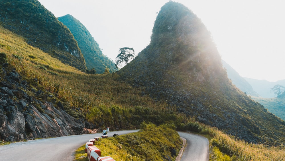 road near mountain during daytime photo