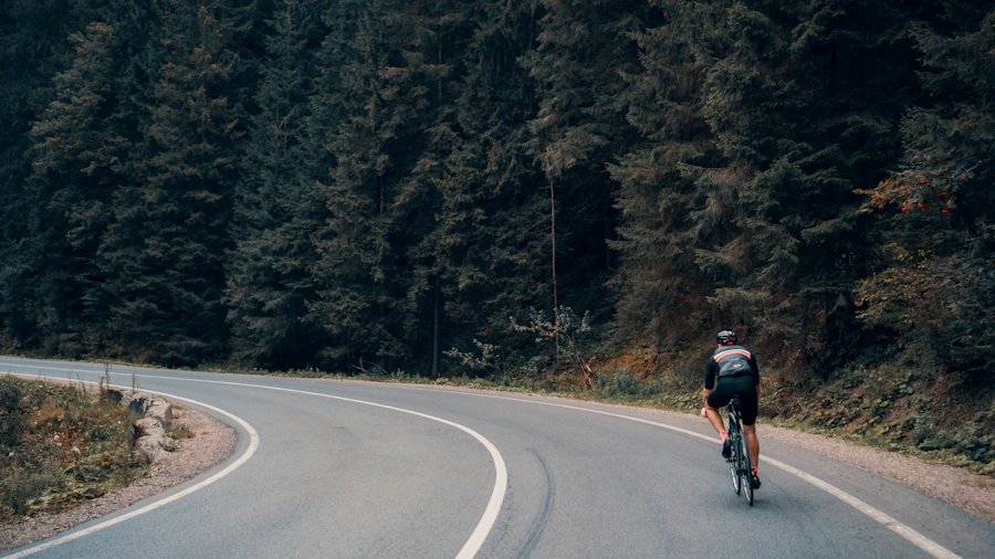 Cyclist riding on a scenic road at moderate pace