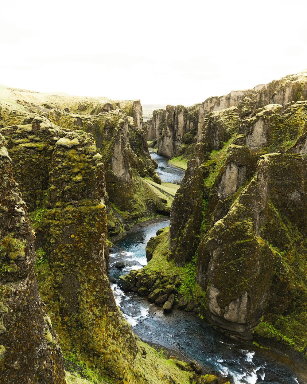 aerial photography of river between mountain