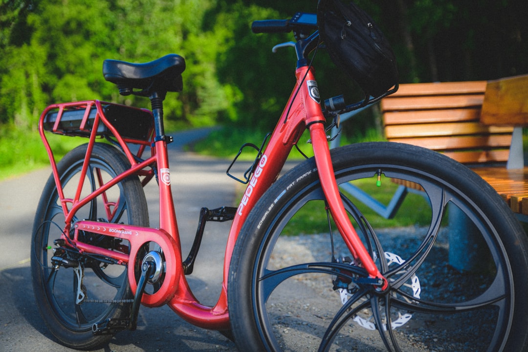 red and black step-through bicycle