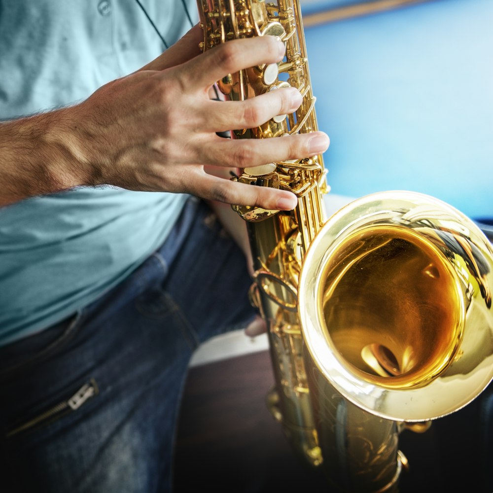 man showing saxophone