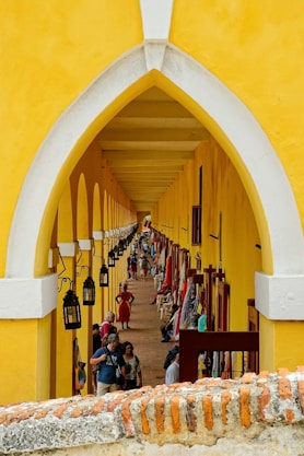 people in yellow building